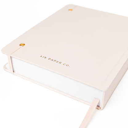 Beige notebook with 'LIV PAPER CO.' branding on a white background