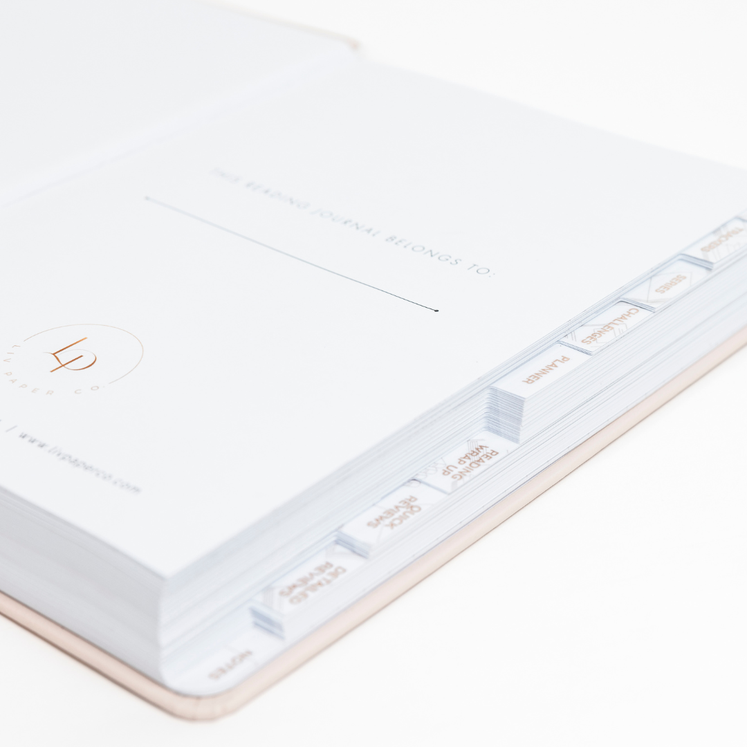 Close-up of a stepped tabs of reading journal on a white background