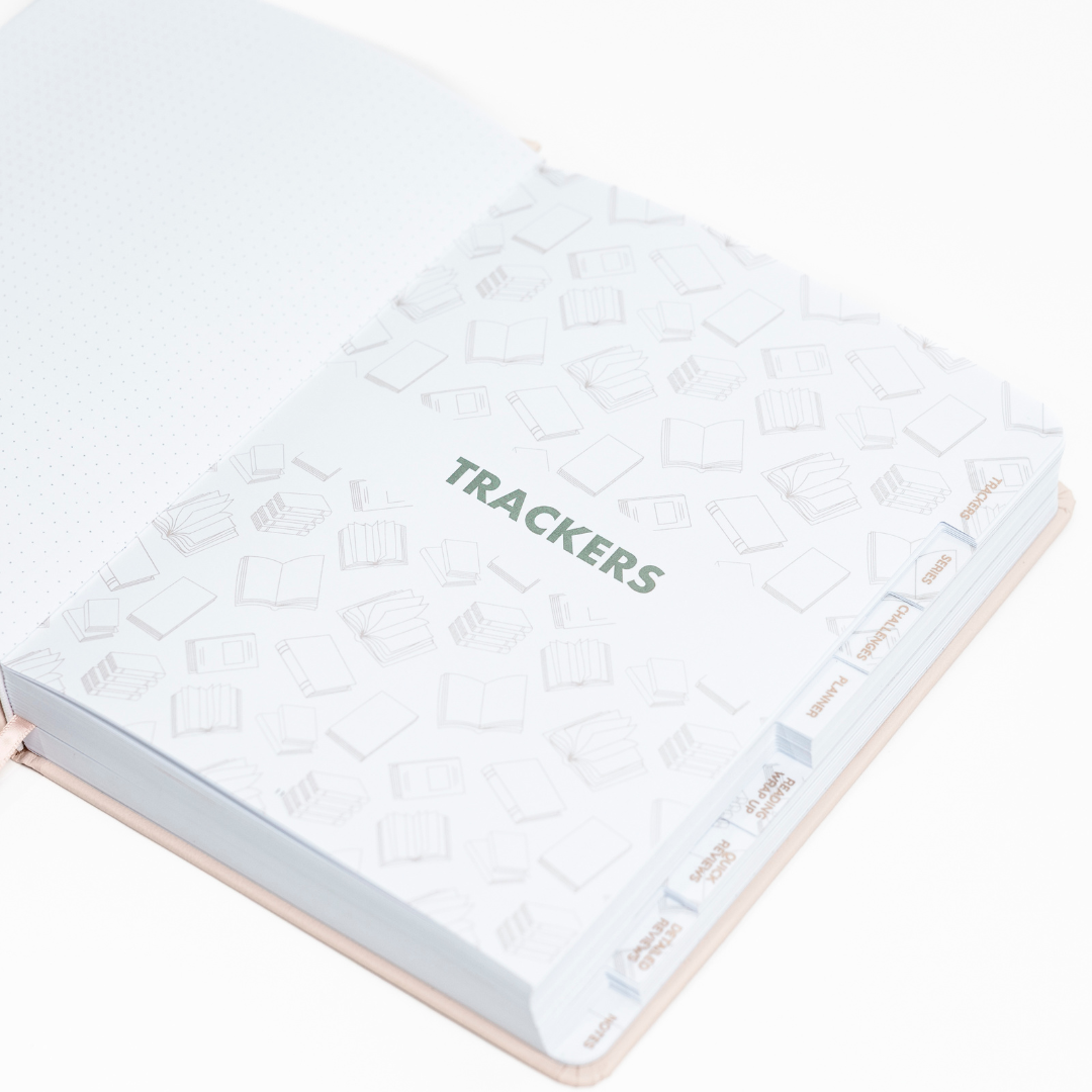 Undated Reading Journal with 'Trackers' on a white background